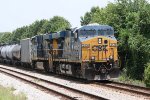 CSX 5438 and 5382 pause with a line of tank cars